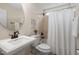 Classic bathroom with pedestal sink, toilet, and bathtub/shower combination at 1602 Eagle Lodge Ln, Durham, NC 27703