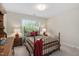 Charming bedroom with a cozy bed, two lamps, and ample natural light for a restful retreat at 1602 Eagle Lodge Ln, Durham, NC 27703