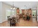 Eat-in kitchen featuring wood cabinets, center island with seating, and stainless steel appliances at 1602 Eagle Lodge Ln, Durham, NC 27703