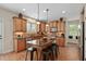 Gourmet kitchen with stainless steel appliances, granite countertops, and a center island with seating at 1602 Eagle Lodge Ln, Durham, NC 27703