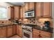 Well-equipped kitchen with granite counters, stainless steel oven, and custom cabinetry at 1602 Eagle Lodge Ln, Durham, NC 27703
