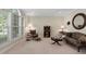 Comfortable living room with large window, patterned sofa, and traditional decor at 1602 Eagle Lodge Ln, Durham, NC 27703