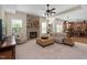 Cozy living room with a brick fireplace, plush seating, and an open layout to the kitchen at 1602 Eagle Lodge Ln, Durham, NC 27703