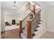 Beautiful staircase with wood and iron railings leading to the upper level at 1602 Eagle Lodge Ln, Durham, NC 27703