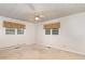 This spacious bedroom features neutral carpeting and two windows to let the natural light flood in at 1750 Spring Valley Lake Rd, Henderson, NC 27537