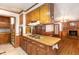 Classic kitchen with wood accents and a functional center island, perfect for cooking and gathering at 1750 Spring Valley Lake Rd, Henderson, NC 27537