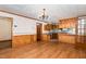 Bright living room featuring classic chandelier and wood accents, creating a warm atmosphere at 1750 Spring Valley Lake Rd, Henderson, NC 27537