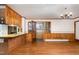 Spacious living room with wood paneling and hardwood floors, offering an open, inviting space at 1750 Spring Valley Lake Rd, Henderson, NC 27537