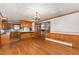Open living area with wood floors adjacent to the kitchen, designed for easy entertaining and living at 1750 Spring Valley Lake Rd, Henderson, NC 27537