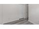 Bedroom with modern gray floors and a spacious closet at 1808 Elkpark Dr, Raleigh, NC 27610