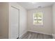 Cozy bedroom with natural light, ample closet space, and neutral decor offers a comfortable retreat at 1808 Elkpark Dr, Raleigh, NC 27610