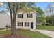 Charming two-story home with a manicured lawn and inviting entrance, perfect for a growing Gathering or first-time buyers at 1808 Elkpark Dr, Raleigh, NC 27610