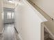 Bright hallway with staircase, closet space, and neutral colors offers a functional and stylish transition between spaces at 1808 Elkpark Dr, Raleigh, NC 27610