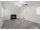 Bright living room with fireplace and ample space offers a comfortable and inviting area for relaxation and entertainment at 1808 Elkpark Dr, Raleigh, NC 27610