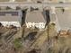 An aerial shot showcasing home, yards, and patios, perfect for enjoying the outdoors at 1911 Firenza Dr, Apex, NC 27502