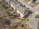 An aerial view shows backyards with lawns and patios for outdoor living at 1911 Firenza Dr, Apex, NC 27502