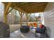 Covered back patio with fire pit, grill and outdoor seating area at 1911 Firenza Dr, Apex, NC 27502