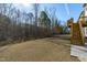 Flat backyard featuring a fenced in yard with mature trees in the distance at 1911 Firenza Dr, Apex, NC 27502