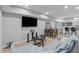 Finished basement featuring a large TV, sofa and bar area for entertaining at 1911 Firenza Dr, Apex, NC 27502