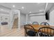 Finished basement with wood floors, stairs and seating area at 1911 Firenza Dr, Apex, NC 27502