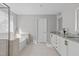 Bathroom featuring a soaking tub, tiled flooring, and granite countertops at 1911 Firenza Dr, Apex, NC 27502