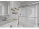 Bathroom features a walk-in shower with glass doors and decorative shelves at 1911 Firenza Dr, Apex, NC 27502