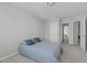 Cozy bedroom with soft carpet, neutral walls, and a comfortable bed at 1911 Firenza Dr, Apex, NC 27502