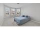 Inviting bedroom with carpet and three windows providing plenty of natural light at 1911 Firenza Dr, Apex, NC 27502