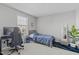Bedroom featuring a black gaming chair and blue accents at 1911 Firenza Dr, Apex, NC 27502