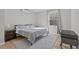 Comfortable bedroom features a large window, LVP flooring, and soft carpet at 1911 Firenza Dr, Apex, NC 27502