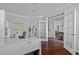 Bright office space with hardwood floors, built-in shelves, desk, and open doorway at 1911 Firenza Dr, Apex, NC 27502