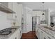 This bright kitchen features granite counters, stainless steel appliances, and convenient access to the living area at 1911 Firenza Dr, Apex, NC 27502