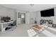 Multi-purpose room with a desk, TV, and comfortable seating area at 1911 Firenza Dr, Apex, NC 27502