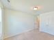 Bright bedroom featuring neutral paint, carpet floors, and a double door closet at 2065 Alderman Way, Creedmoor, NC 27522