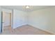 Neutral bedroom featuring carpet floors, a double door closet, and easy access to the ensuite bathroom at 2065 Alderman Way, Creedmoor, NC 27522