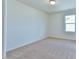 Unfurnished bedroom with carpet floors, a window and natural light at 2065 Alderman Way, Creedmoor, NC 27522