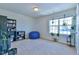 Spacious room with carpet floors and a large window providing natural light at 2065 Alderman Way, Creedmoor, NC 27522