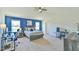 Bedroom with blue accent wall, lots of natural light, and a comfortable layout at 2065 Alderman Way, Creedmoor, NC 27522