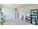 Bright bedroom featuring carpet floors, a double door closet, and access to the ensuite bathroom at 2065 Alderman Way, Creedmoor, NC 27522