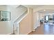 Open entryway with wood flooring, staircase, and an arched entrance to the living space at 2065 Alderman Way, Creedmoor, NC 27522