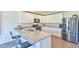 Modern kitchen with stainless steel appliances, white cabinetry, and granite countertops at 2065 Alderman Way, Creedmoor, NC 27522