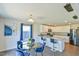 Bright kitchen with white cabinets, stainless appliances, granite countertops, and adjacent dining area at 2065 Alderman Way, Creedmoor, NC 27522