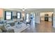 Spacious living room with hardwood floors, plenty of natural light, and open access to kitchen at 2065 Alderman Way, Creedmoor, NC 27522