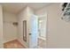 Walk-in closet with closet rods, full length mirror, and entrance to the bathroom at 2065 Alderman Way, Creedmoor, NC 27522