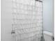 Clean bathroom with white shower curtain and a white commode at 2108 Canterbury Rd, Clayton, NC 27520