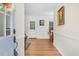 Bright foyer showcasing gleaming hardwood floors and elegant trim detail at 2108 Canterbury Rd, Clayton, NC 27520