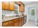 Well-lit kitchen with stainless steel appliances and granite countertops, offers functionality and style at 2108 Canterbury Rd, Clayton, NC 27520