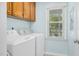 Bright laundry room features modern washer and dryer and natural light from the exterior at 2108 Canterbury Rd, Clayton, NC 27520