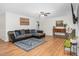 Spacious living room features hardwood floors, a comfortable seating area, and natural light at 2108 Canterbury Rd, Clayton, NC 27520