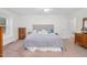 Cozy bedroom with natural light, plush bedding, and comfortable layout at 2108 Canterbury Rd, Clayton, NC 27520